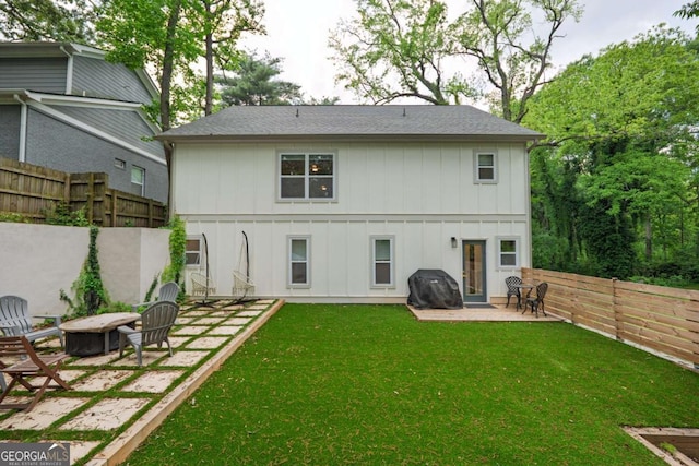 82 Dearborn St SE, Atlanta, GA 30317 - back of house with a fire pit, a patio, board and batten siding, and a shingled roof