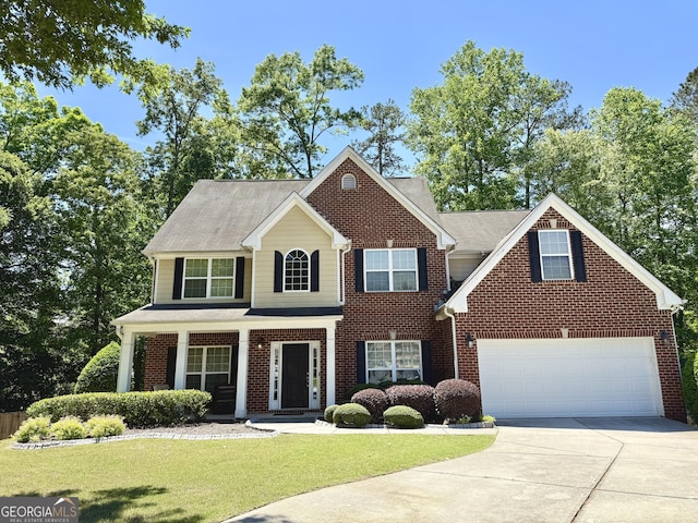 345 Manning Ct, South Fulton, GA 30349 - view of front facade featuring driveway, a front yard, and brick siding
