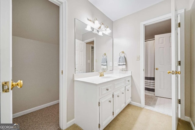 bathroom with vanity and baseboards