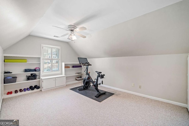 workout area with vaulted ceiling, ceiling fan, carpet, built in features, and baseboards