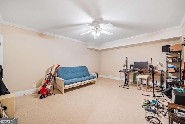 game room with a desk, ornamental molding, carpet flooring, baseboards, and a ceiling fan