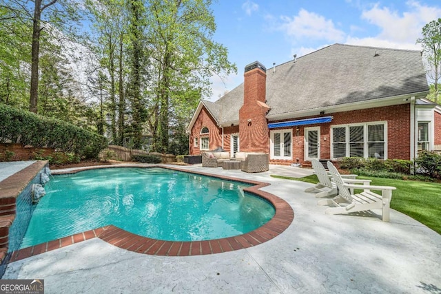 view of swimming pool featuring an outdoor living space, a patio area, and a fenced backyard
