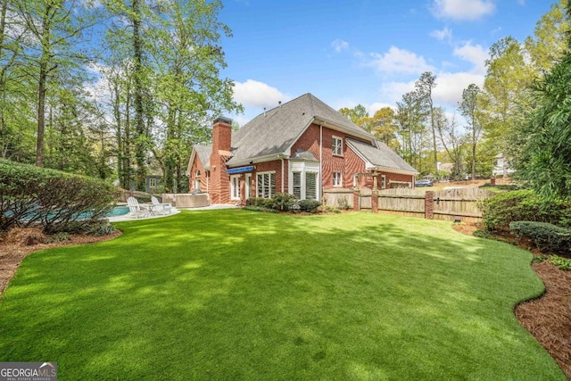 250 Chason Wood Way, Roswell, GA 30076 - back of house featuring brick siding, a chimney, and roof with shingles