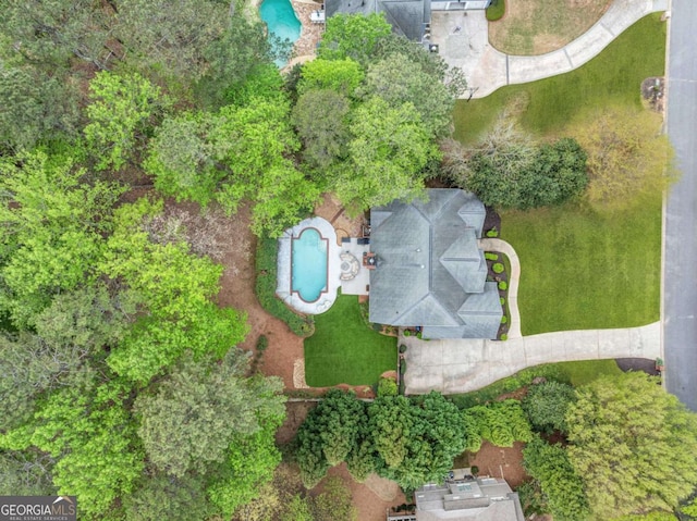 view of property location featuring a pool