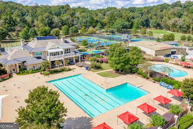 community pool featuring a patio area