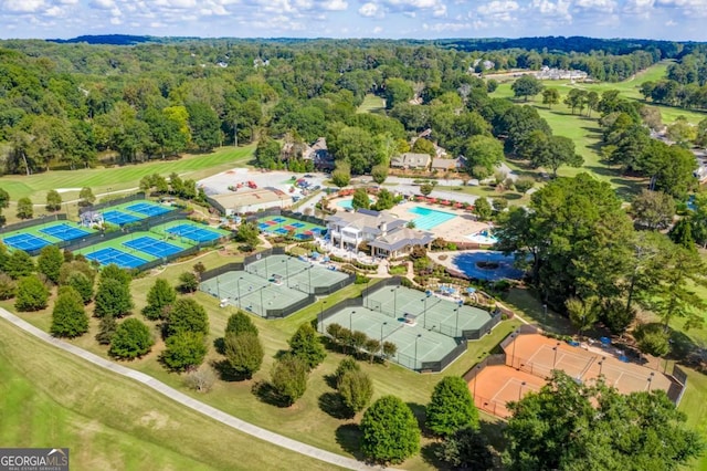 aerial view of a heavily wooded area and a golf club
