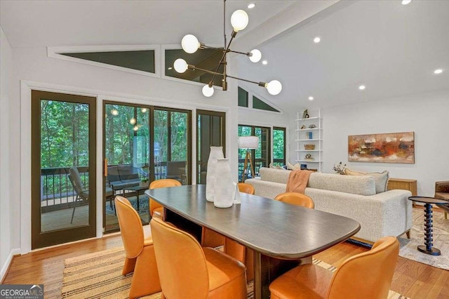 dining room featuring high vaulted ceiling, a chandelier, light wood finished floors, beam ceiling, and recessed lighting