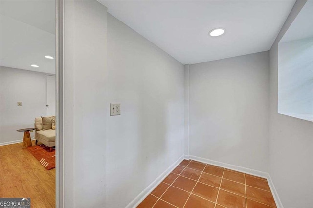 corridor with baseboards and recessed lighting