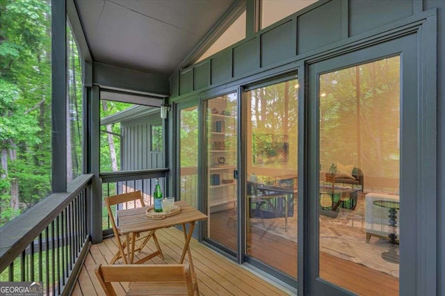 sunroom / solarium with lofted ceiling and healthy amount of natural light