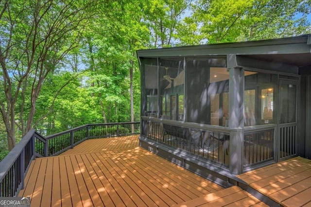 wooden terrace featuring a sunroom