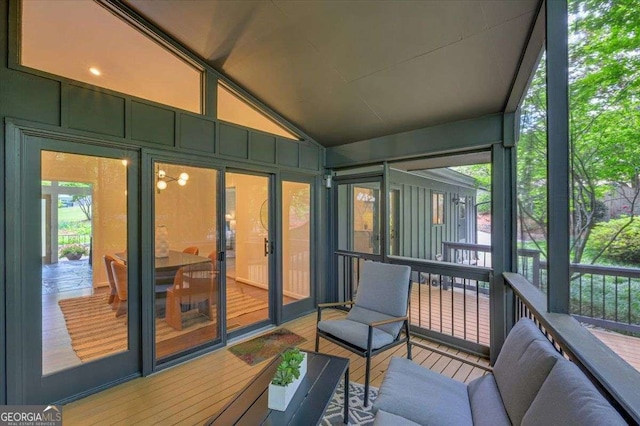 sunroom / solarium with vaulted ceiling