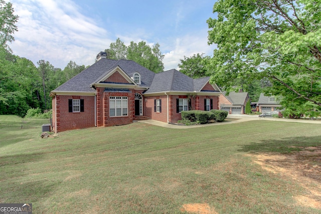 135 Magnolia Dr, Oxford, GA 30054 - view of front of home featuring a chimney, cooling unit, brick siding, and a front yard