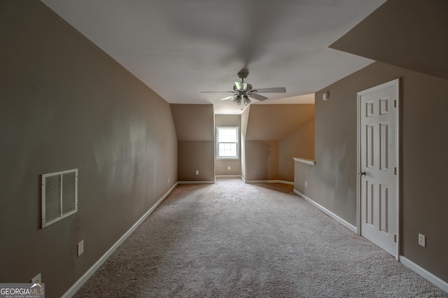 135 Magnolia Dr, Oxford, GA 30054 - bonus room featuring lofted ceiling, baseboards, carpet flooring, ceiling fan, and visible vents