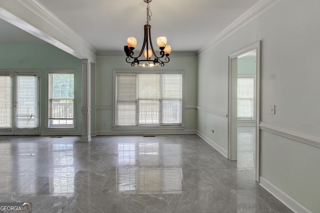135 Magnolia Dr, Oxford, GA 30054 - spare room featuring an inviting chandelier, a wealth of natural light, marble finish floor, and crown molding