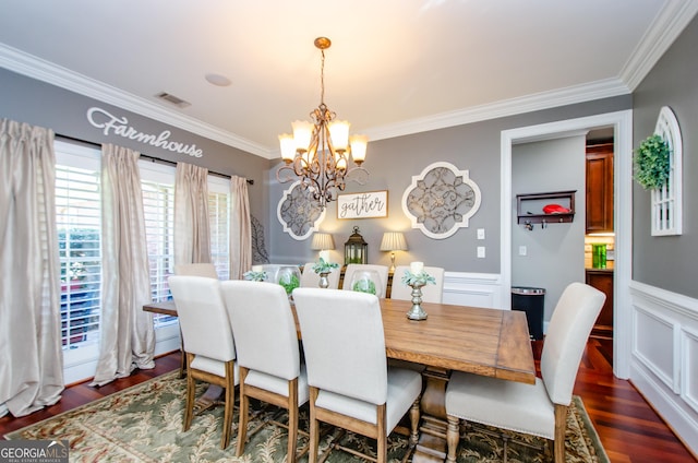 1340 Traditions Way, Jefferson, GA 30549 - dining area featuring a chandelier, crown molding, dark wood-style floors, a wainscoted wall, and a decorative wall