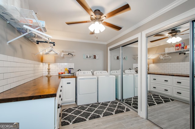 1340 Traditions Way, Jefferson, GA 30549 - washroom featuring independent washer and dryer, a ceiling fan, cabinet space, crown molding, and light wood-type flooring