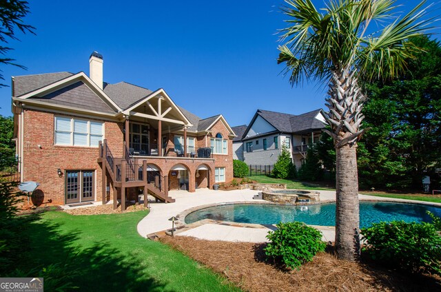1340 Traditions Way, Jefferson, GA 30549 - view of swimming pool with stairs, a lawn, a patio, a pool with connected hot tub, and french doors