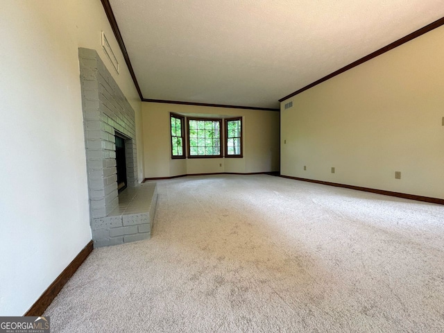 5307 Red Rock Trce, Powder Springs, GA 30127 - unfurnished living room featuring crown molding, light carpet, baseboards, and a fireplace