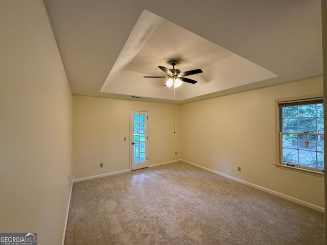5307 Red Rock Trce, Powder Springs, GA 30127 - carpeted empty room featuring a raised ceiling, baseboards, and ceiling fan