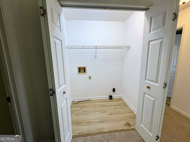 5307 Red Rock Trce, Powder Springs, GA 30127 - laundry room featuring hookup for a washing machine, baseboards, and light wood-style floors