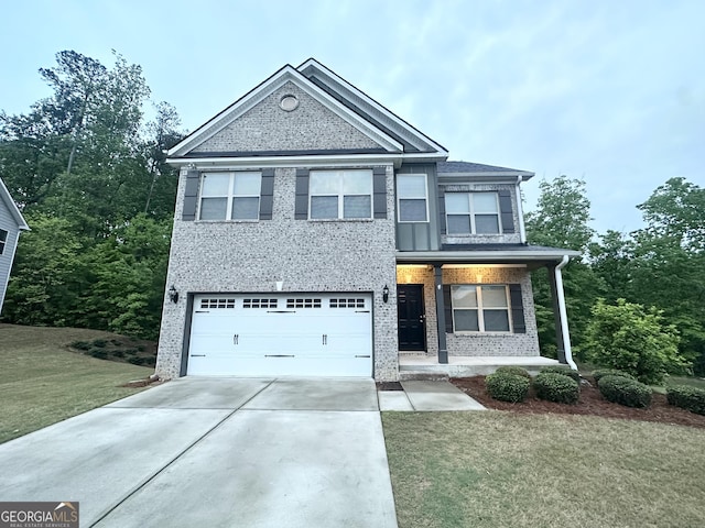 view of front facade with concrete driveway, a garage, a front lawn, and brick siding