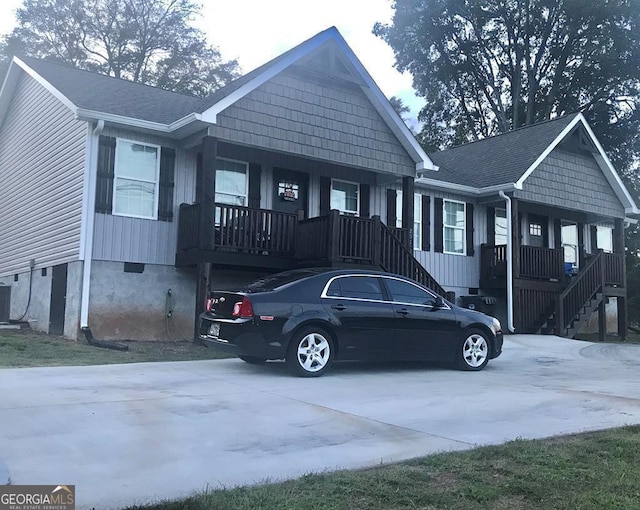 201 Jones St, Dalton, GA 30720 - view of front of home featuring covered porch, central AC unit, stairway, and crawl space