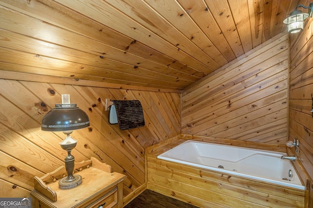 bathroom with wooden walls, a tub to relax in, and wood ceiling