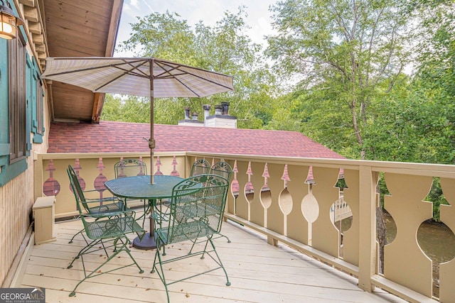 wooden deck with outdoor dining space