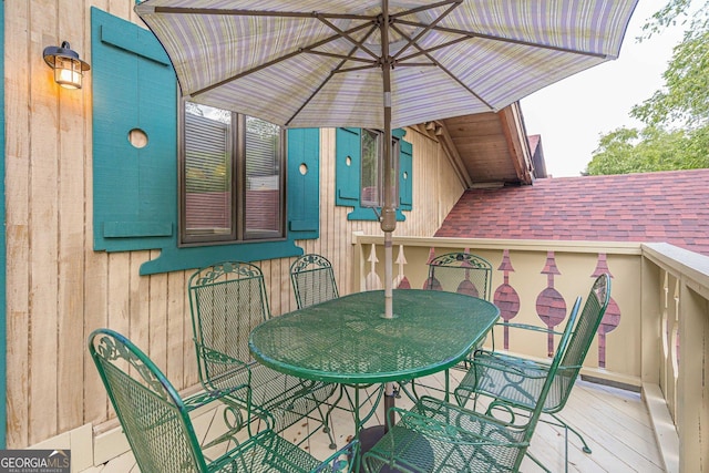 wooden deck with outdoor dining area