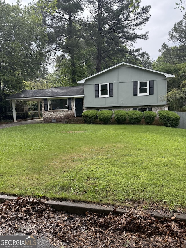 170 Peachtree Ct, Riverdale, GA 30274 - tri-level home featuring an attached carport, a front yard, and brick siding