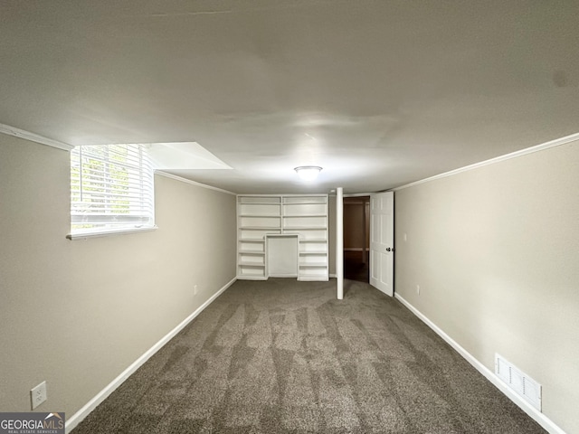1814 Mary Lou Ln SE, Atlanta, GA 30316 - basement with carpet flooring, crown molding, visible vents, and baseboards