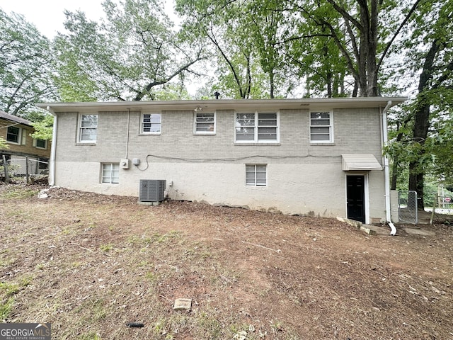 1814 Mary Lou Ln SE, Atlanta, GA 30316 - rear view of property featuring central AC unit, fence, and brick siding