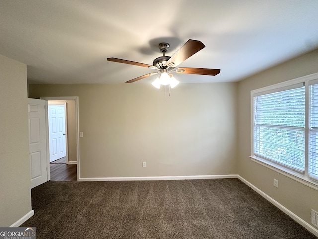 1814 Mary Lou Ln SE, Atlanta, GA 30316 - spare room with dark colored carpet, baseboards, and a ceiling fan