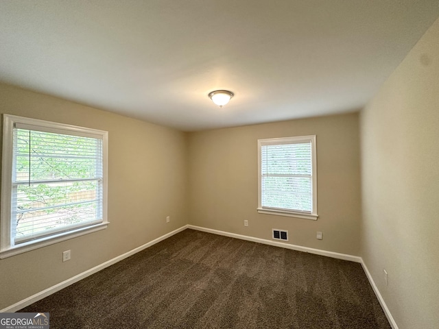 1814 Mary Lou Ln SE, Atlanta, GA 30316 - empty room featuring visible vents, baseboards, and dark carpet