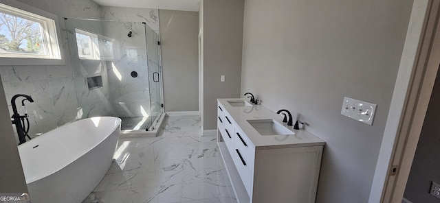 full bath with a sink, a soaking tub, a marble finish shower, and marble finish floor