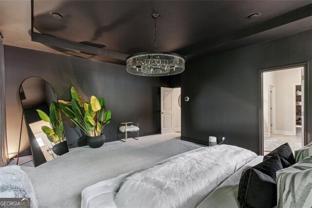 carpeted bedroom with a chandelier and baseboards