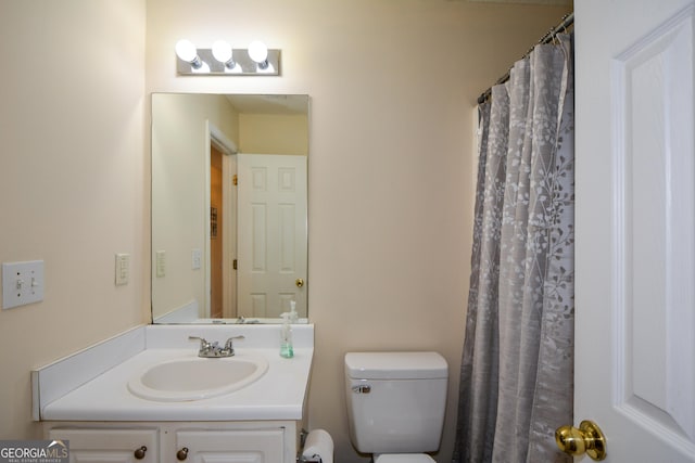 full bathroom featuring toilet and vanity