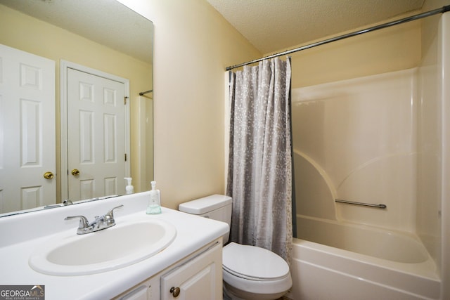 full bath featuring toilet, a textured ceiling, vanity, and shower / bath combo with shower curtain