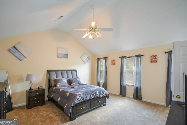 carpeted bedroom with vaulted ceiling, baseboards, and ceiling fan