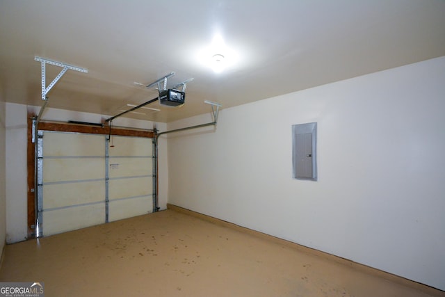 garage featuring a garage door opener and electric panel
