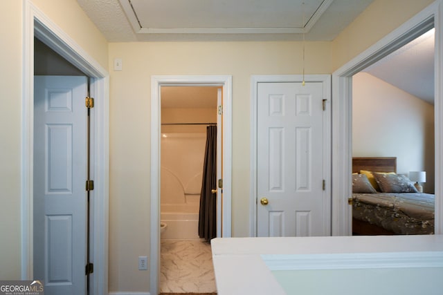 bedroom with attic access and marble finish floors