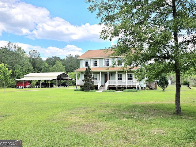 view of front of property featuring covered porch, a carport, and a front yard