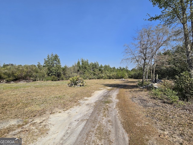 view of street with a forest view