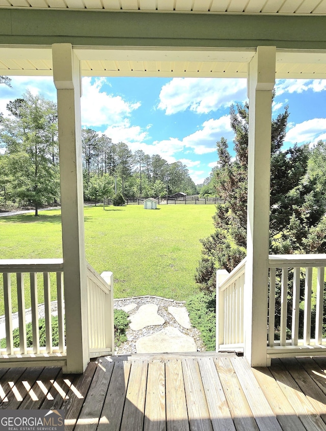 wooden deck with a yard