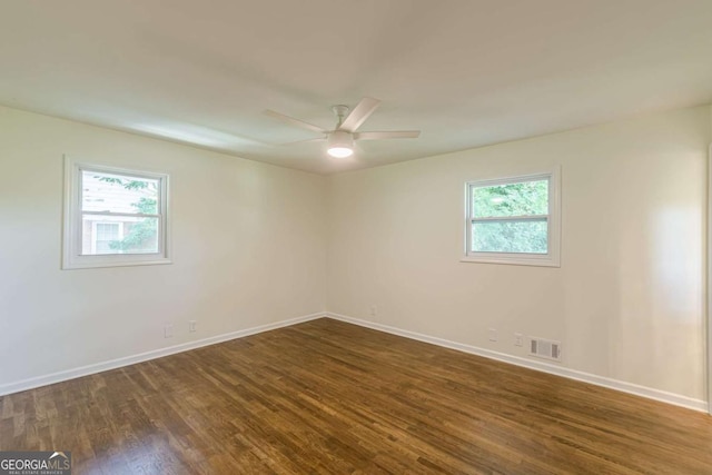 3275 Clifton Church Rd SE, Atlanta, GA 30316 - unfurnished room featuring a wealth of natural light, baseboards, visible vents, and dark wood finished floors
