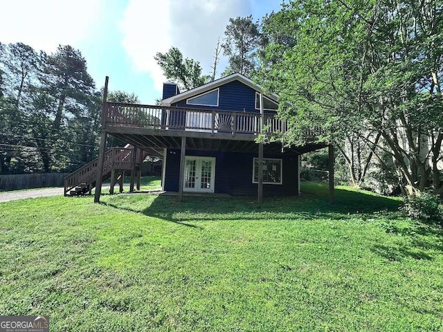 4464 Cary Dr, Snellville, GA 30039 - back of house featuring a deck, stairs, french doors, a chimney, and a lawn