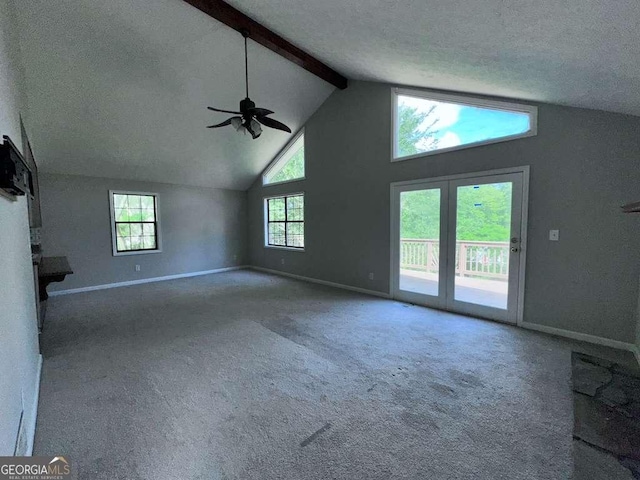 4464 Cary Dr, Snellville, GA 30039 - unfurnished living room featuring a wealth of natural light, baseboards, a ceiling fan, and beamed ceiling
