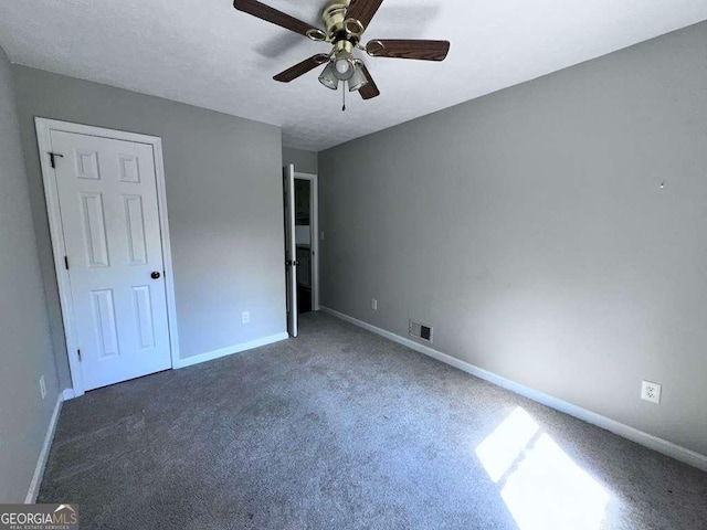 4464 Cary Dr, Snellville, GA 30039 - unfurnished bedroom with baseboards, a ceiling fan, visible vents, and carpet