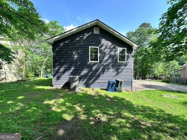 4464 Cary Dr, Snellville, GA 30039 - view of side of home with a yard and fence
