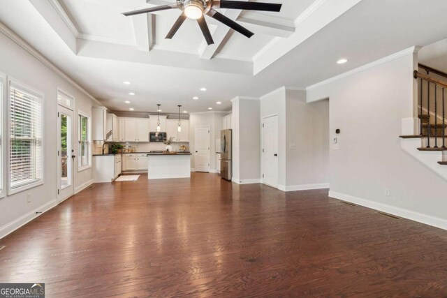 unfurnished living room with stairs, ceiling fan, beam ceiling, recessed lighting, and dark wood-type flooring